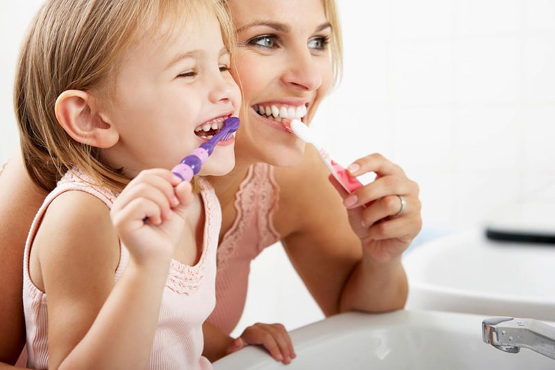 kids-and-parents-brushing-teeth-together.jpg